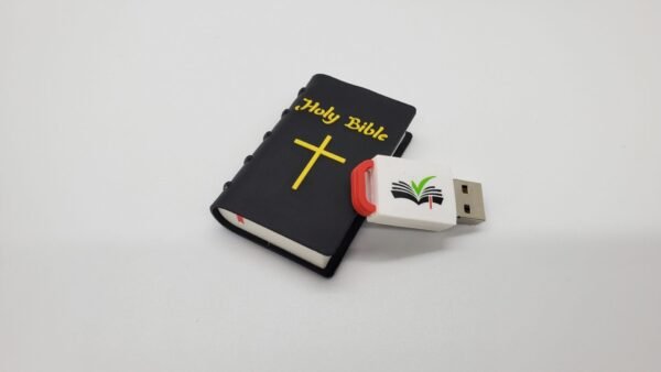 The Hope Drive: Seminar Files and Audio Bible is a USB flash drive designed as a black Holy Bible with a yellow cross, "Holy Bible" text on the cover, and an open book logo on its white connector. The background is plain white.