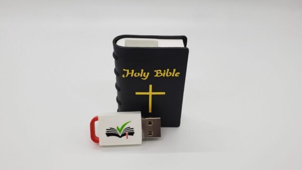 A small, black Holy Bible with gold lettering and a cross stands upright. In front is the Hope Drive: Seminar Files and Audio Bible USB, featuring a red cap and an open book logo with a green checkmark, both on a plain white background.