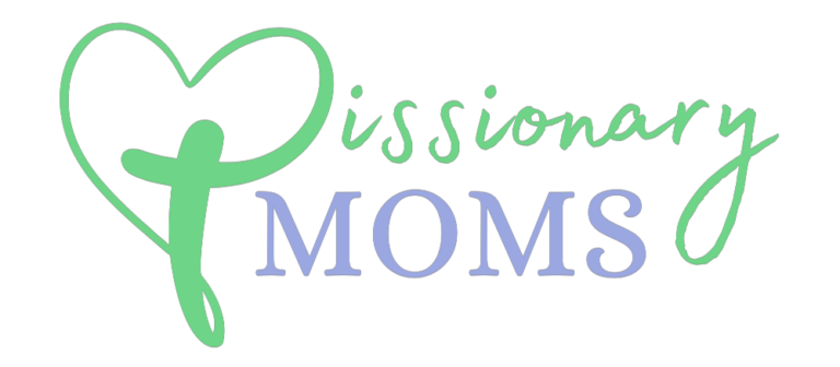 The image shows the words &ldquo;Missionary Moms.&rdquo; The &ldquo;M&rdquo; in &ldquo;Missionary&rdquo; is stylized with a green heart forming its left side, and the rest of the text is written in a mix of green script and purple serif fonts on a white background.